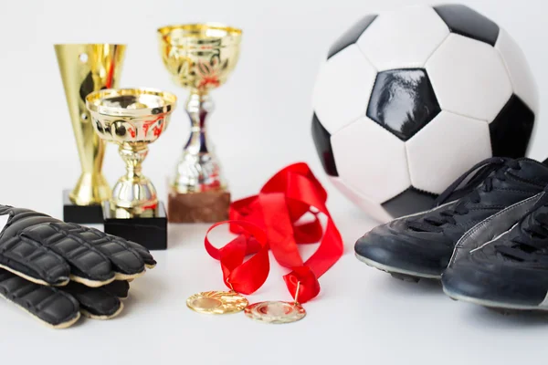 Close up of football, boots, gloves, cup and medal — Stock Photo, Image