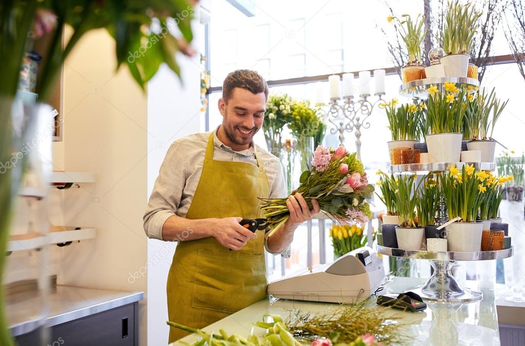 Smiling florist man making bunch at flower shop ⬇ Stock Photo, Image by