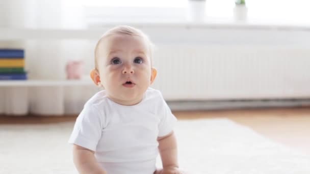 Happy little baby sitting in living room at home 10 — Stock Video