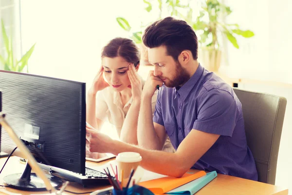 Creative team with reading paper in office — Stock Photo, Image