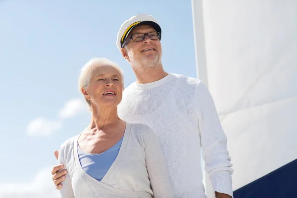 Senior couple hugging on sail boat or yacht in sea — Stock Photo, Image