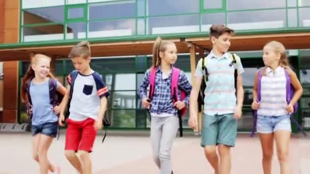 Group of happy elementary school students walking — Stock Video