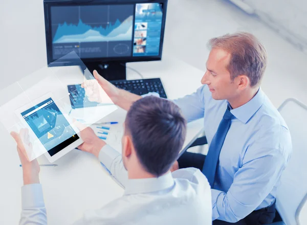 Businessmen with tablet pc and computer at office — Stock Photo, Image