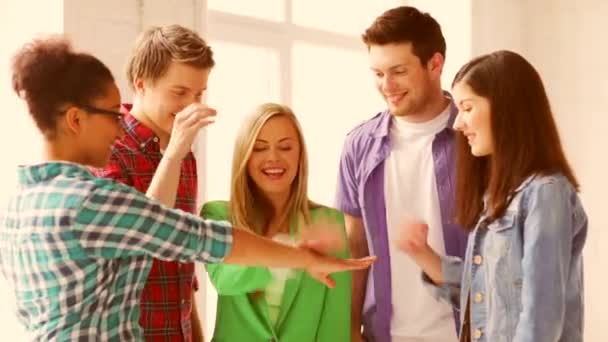 Students in school showing unity with their hands together — Stock Video