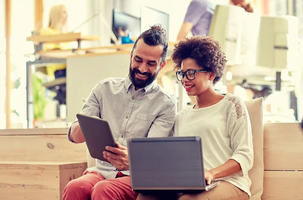 Creative team with laptop and tablet pc in office — Stock Photo, Image