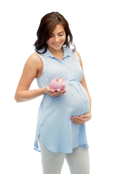 Piggybank で幸せな妊娠中の女性 — ストック写真