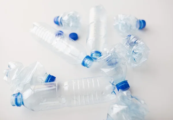 Close up of empty used plastic bottles on table — Stock Photo, Image