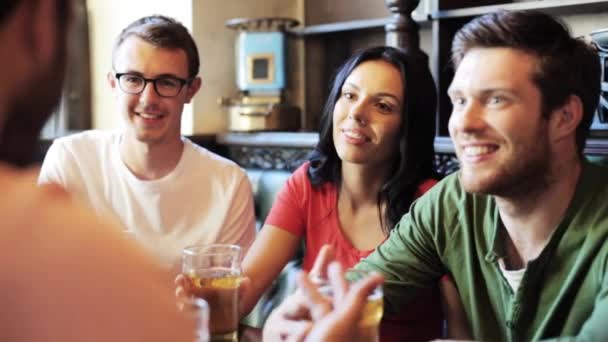 Happy friends drinking beer at bar or pub — Stock Video