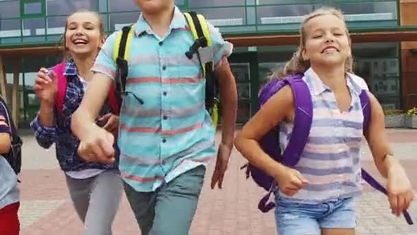 Group of happy elementary school students running — Stock Video