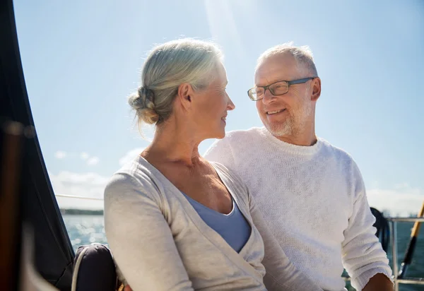 Senior couple hugging on sail boat or yacht in sea — Stock Photo, Image