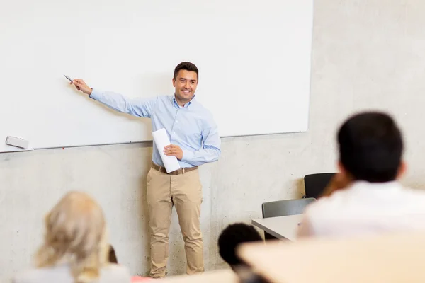 Group of students and teacher on lecture — Stock Photo, Image