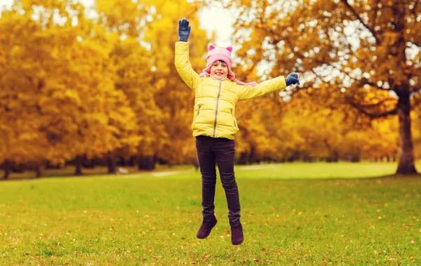 Happy little girl jumping outdoors — Stock Fotó