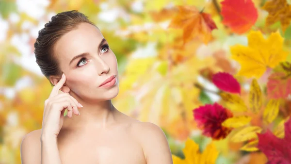 Beautiful young woman touching her face — Stock Photo, Image