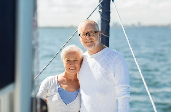 Senior couple hugging on sail boat or yacht in sea — Stock Photo, Image