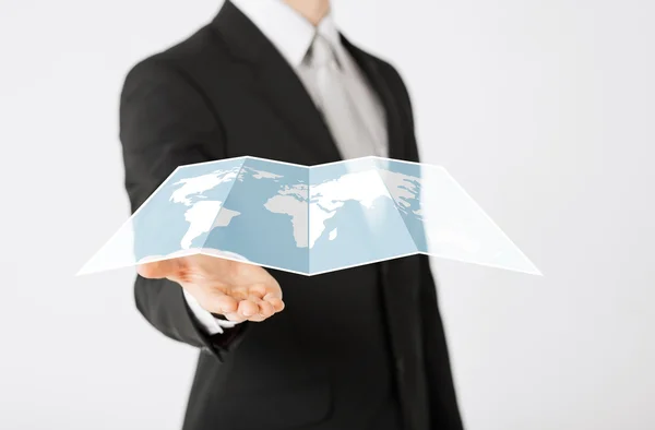 Close up of businessman showing world map — Stock Photo, Image