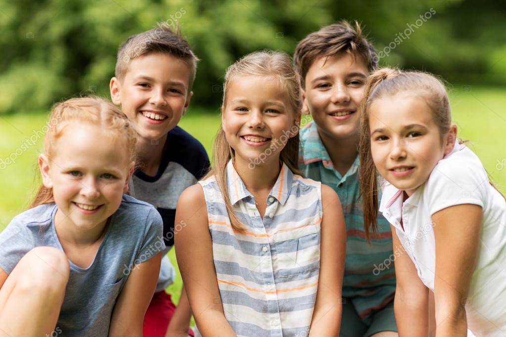 Group of happy kids or friends outdoors Stock Photo by ©Syda_Productions 121551592