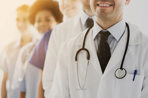 Close up of happy doctors with stethoscope — Stock Photo, Image