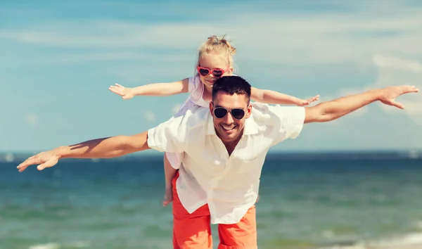 Happy family having fun on summer beach — Stok fotoğraf