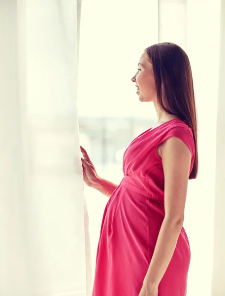 Happy pregnant woman with big tummy at home — Stock Photo, Image