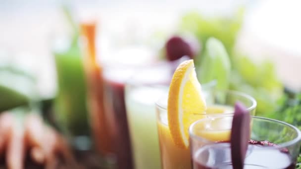 Hand taking glass of vegetable juice from table — Stock Video