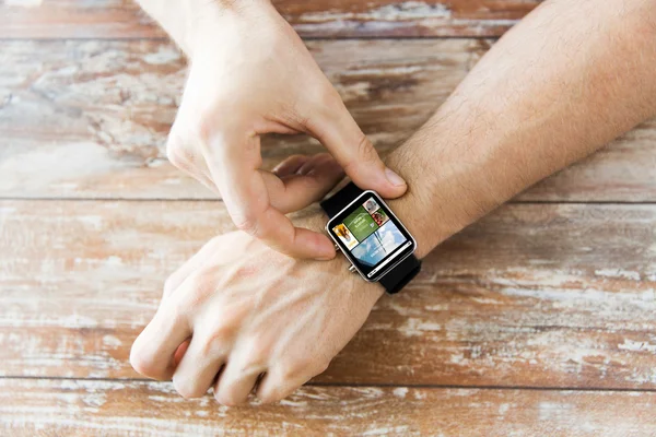 Close up of male hands setting smart watch — Stock Photo, Image