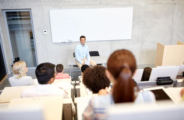Group of students and teacher at lecture — Stock Photo, Image