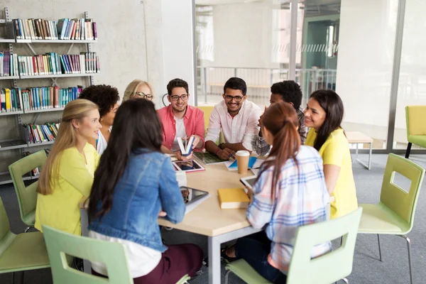 Group of high school students sitting at table — Stock Photo, Image