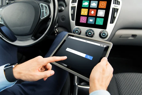 Close up of man with tablet pc in car — Stock Photo, Image