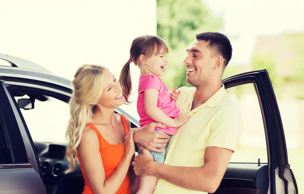 Happy family with child laughing at car parking — Stock Photo, Image