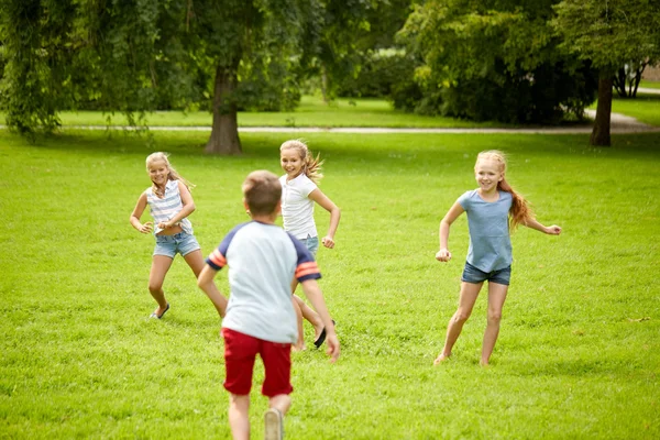 Happy kids running and playing game outdoors — Stock Photo, Image