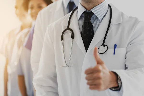 Close up of happy doctor showing thumbs — Stock Photo, Image