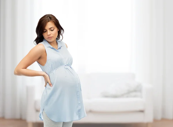 Donna incinta con mal di schiena — Foto Stock