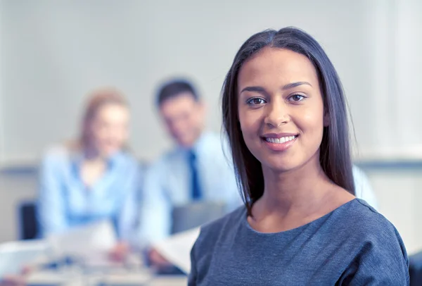 Group of smiling businesspeople meeting in office — Stock Photo, Image