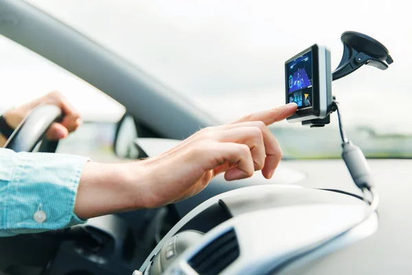 Close up of man with gps navigator driving car — Stock Photo, Image