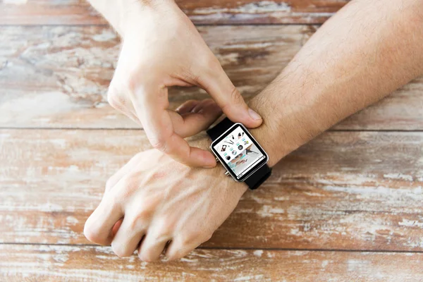 Close up of hands with online shop on smart watch — Stock Photo, Image