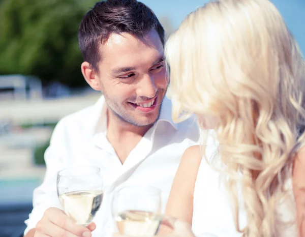 Couple drinking wine in cafe — Stock Photo, Image