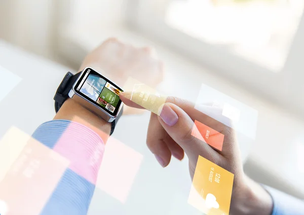 Close up of female hands with news on smart watch — Stock Photo, Image