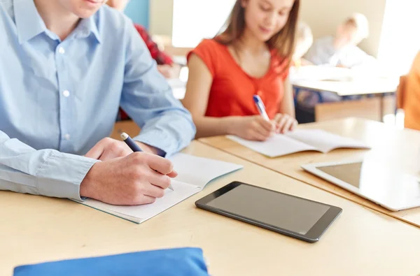Close up of students tablet pc writing at school — Stock Photo, Image