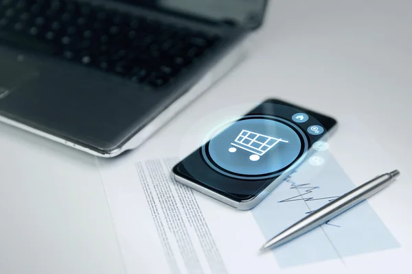 Close up of smartphone with shopping cart icon — Stock Photo, Image