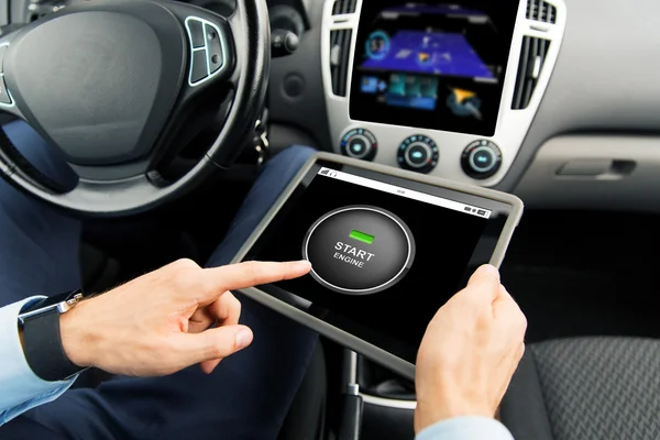 Close up of man with tablet pc in car — Stock Photo, Image