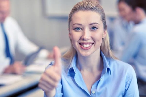 Group of smiling businesspeople meeting in office — Stock Photo, Image