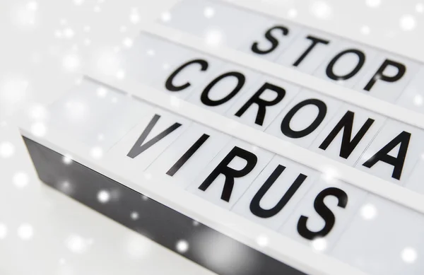 Close up of lightbox with stop corona virus words — Stock fotografie