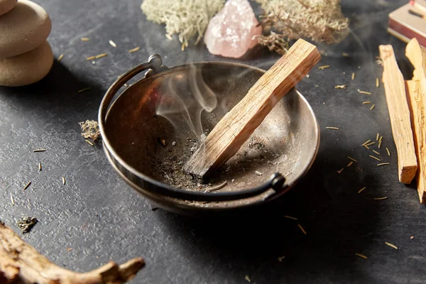 Palo santo stick in cup and staff for magic ritual — Stock Photo, Image