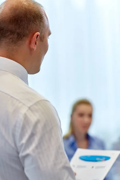 Close up of business team with papers at office — Stock Photo, Image