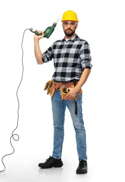 Male worker or builder in helmet with drill — Stock Photo, Image