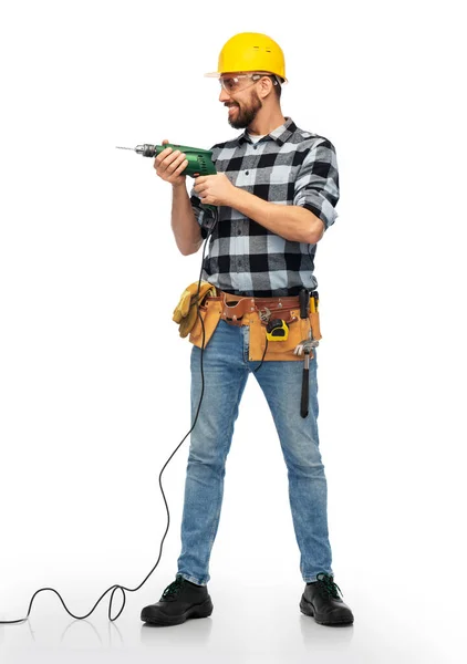 Happy male worker or builder in helmet with drill — Stock Photo, Image