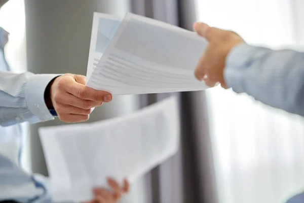 Close up of business team with papers at office — Stock Photo, Image