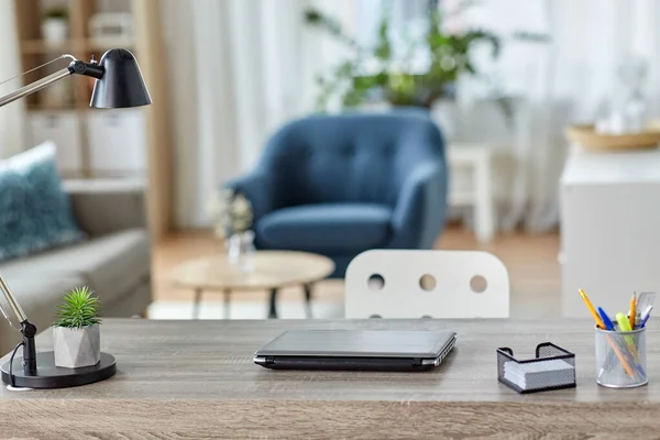 Laptop and stationary on table at home office — Stock Photo, Image