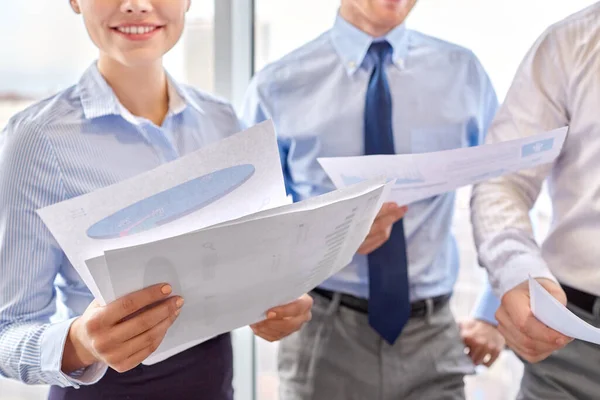 Happy business team with papers meeting at office — Stock Photo, Image