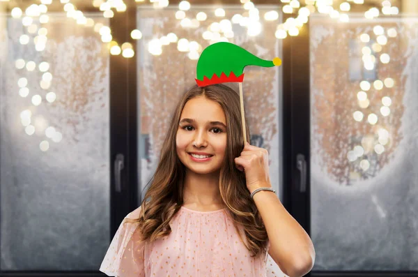 Glücklich Teenager Mädchen mit Weihnachtsmann Helfer Hut Accessoire Stockbild